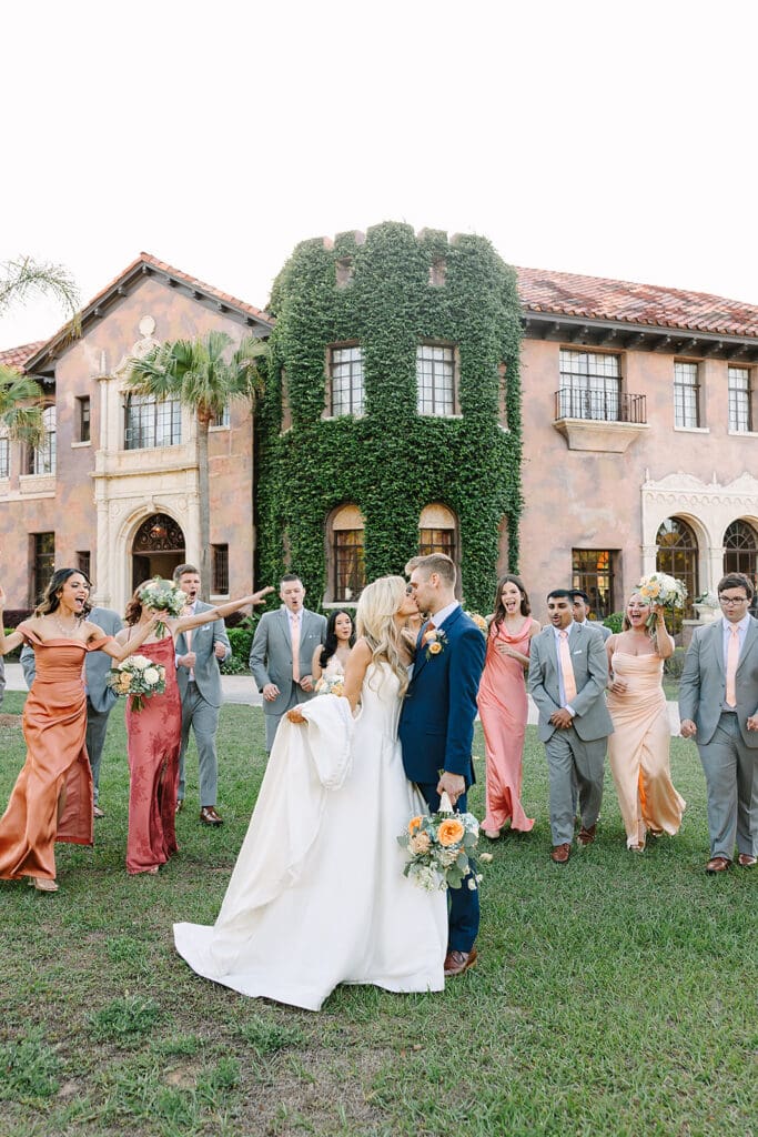 couple with wedding party at The Howey Mansion captured by Jennifer Holly Photography