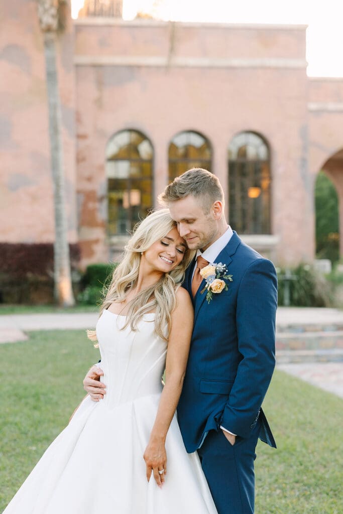 bride and groom outdoor wedding portrait at The Howey Mansion captured by Jennifer Holly Photography