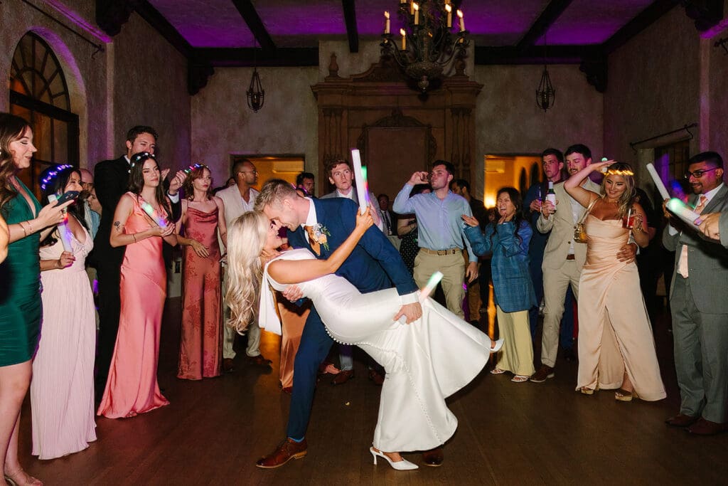 bride and groom dip during dancing at a wedding reception at The Howey Mansion captured by Jennifer Holly Photography