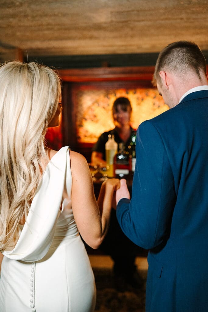bride and groom in the Prohibition Vault at The Howey Mansion captured by Jennifer Holly Photography