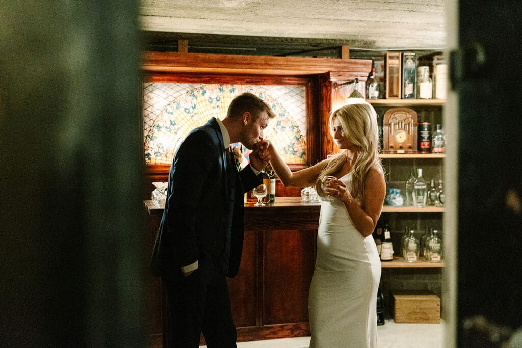 bride and groom in the Prohibition Vault at The Howey Mansion captured by Jennifer Holly Photography