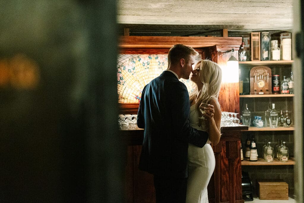bride and groom in the Prohibition Vault at The Howey Mansion captured by Jennifer Holly Photography