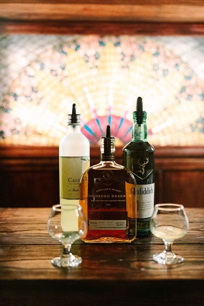 Prohibition Vault Experience details with spirits at The Howey Mansion captured by Jennifer Holly Photography