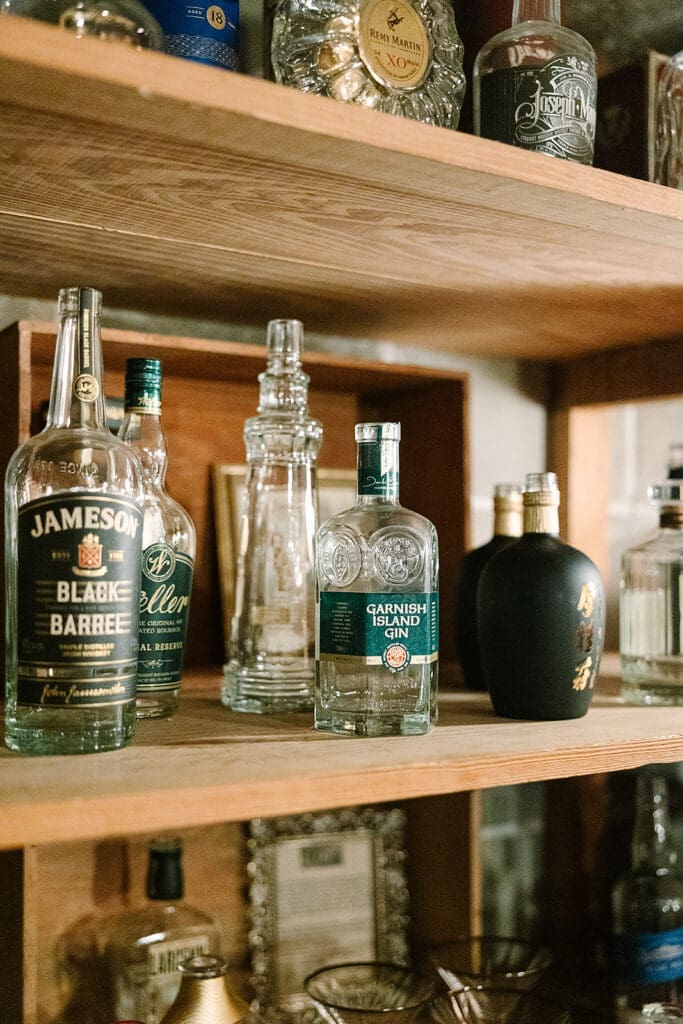 Prohibition Vault Experience details with spirits at The Howey Mansion captured by Jennifer Holly Photography