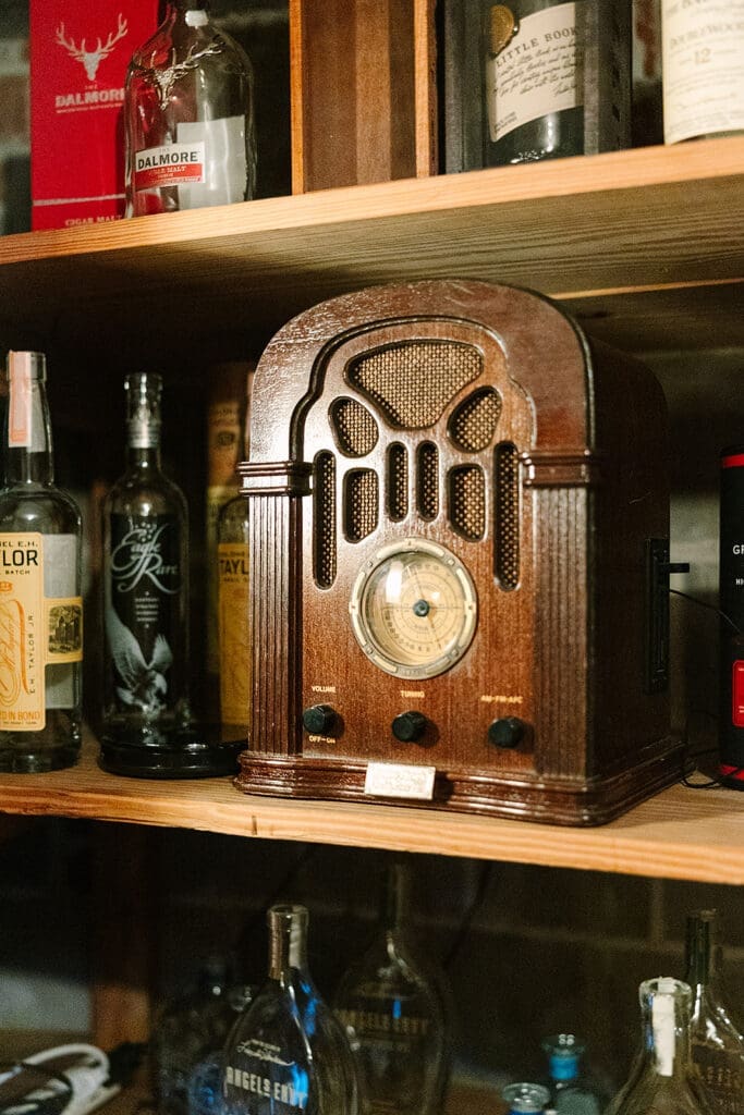 Prohibition Vault Experience details with an antique clock at The Howey Mansion captured by Jennifer Holly Photography