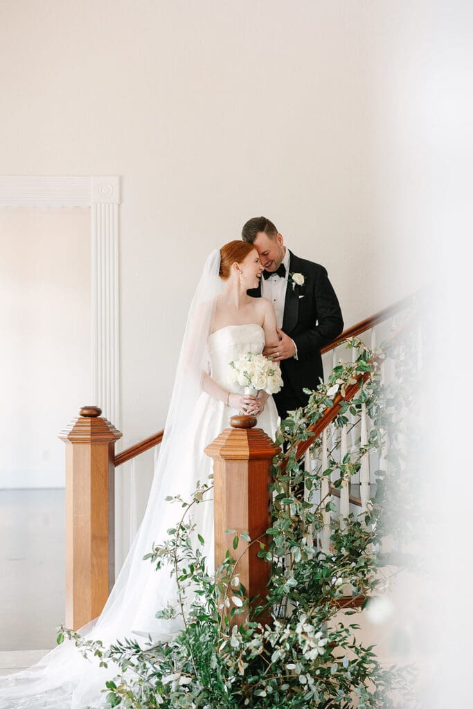 bride and groom portraits on the grande staircase at Florida mansion wedding venue, Luxmore Grande Estate, captured by Jennifer Holly Photography