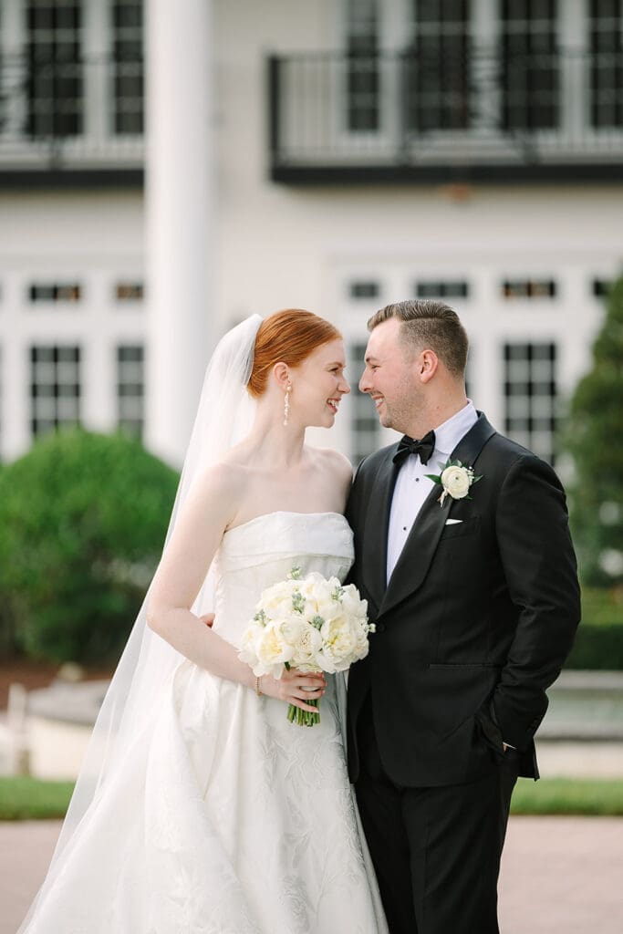 bride and groom portrait in front of their Florida mansion wedding venue, Luxmore Grande Estate, captured by Jennifer Holly Photography