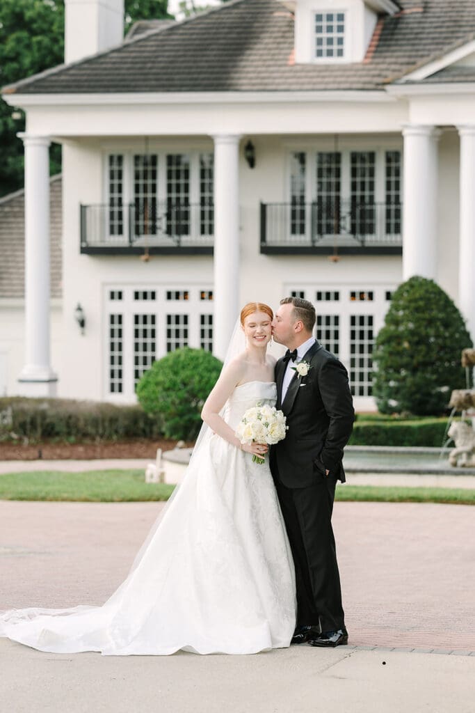 bride and groom portrait in front of their Florida mansion wedding venue, Luxmore Grande Estate, captured by Jennifer Holly Photography