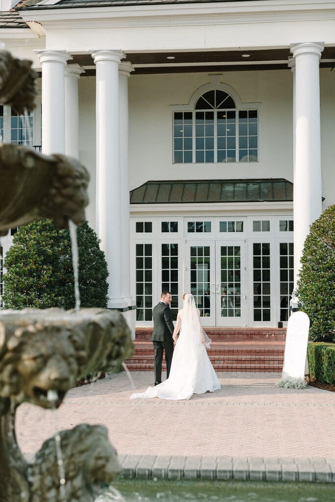 bride and groom portrait in front of their Florida mansion wedding venue, Luxmore Grande Estate, captured by Jennifer Holly Photography