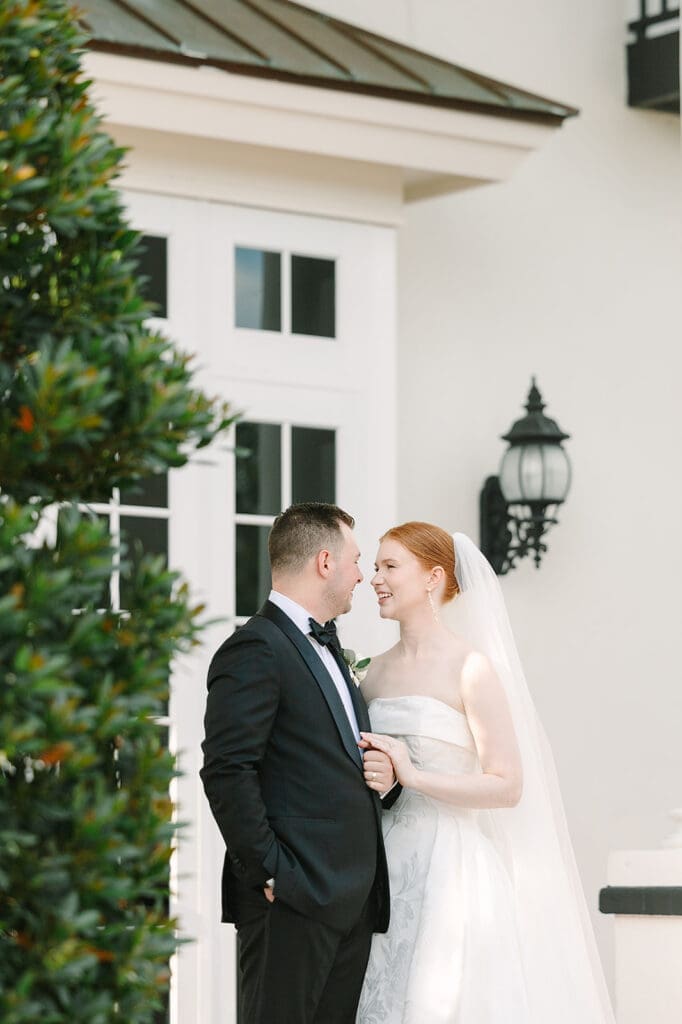 bride and groom portrait in front of their Florida mansion wedding venue, Luxmore Grande Estate, captured by Jennifer Holly Photography