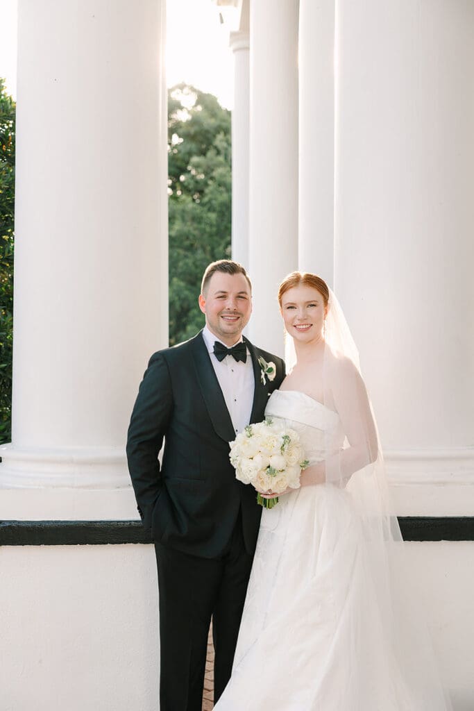 bride and groom portrait in front of their Florida mansion wedding venue, Luxmore Grande Estate, captured by Jennifer Holly Photography