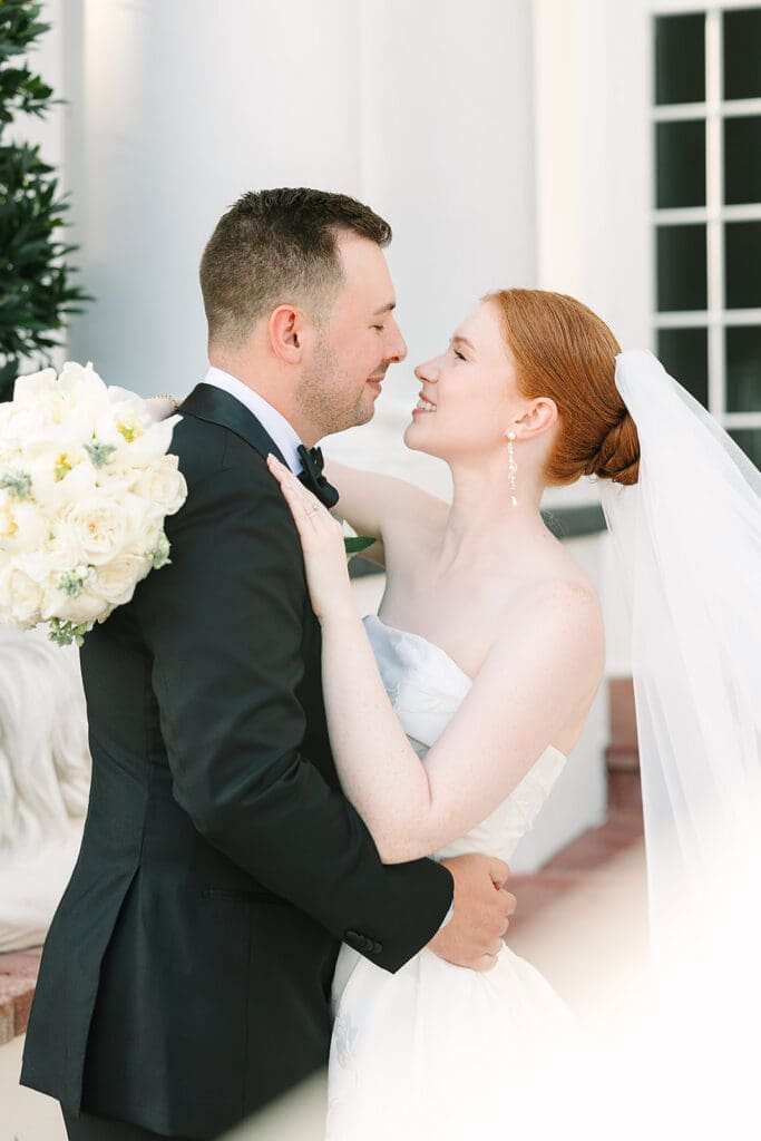 bride and groom portrait in front of their Florida mansion wedding venue, Luxmore Grande Estate, captured by Jennifer Holly Photography