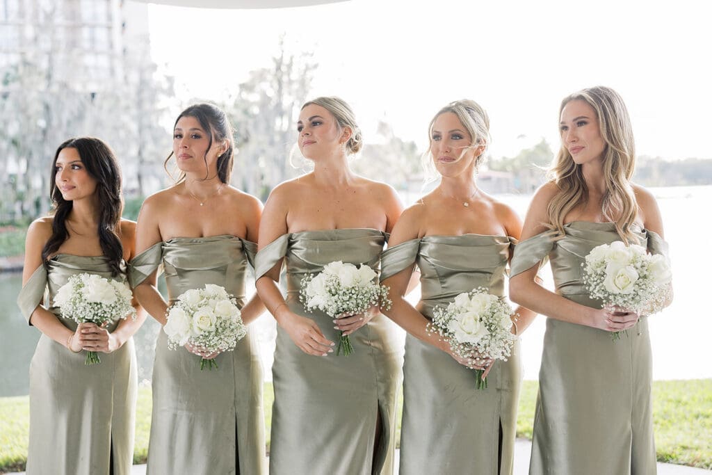 bridesmaids in an outdoor wedding ceremony at Hyatt Regency Grand Cypress Resort in Orlando, Florida, captured by Jennifer Holly Photography