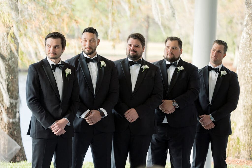 groomsmen in an outdoor wedding ceremony at Hyatt Regency Grand Cypress Resort in Orlando, Florida, captured by Jennifer Holly Photography