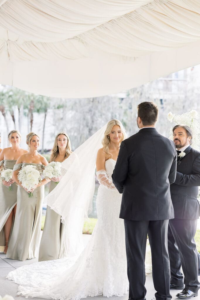 bride and groom in an outdoor wedding ceremony at Hyatt Regency Grand Cypress Resort in Orlando, Florida, captured by Jennifer Holly Photography