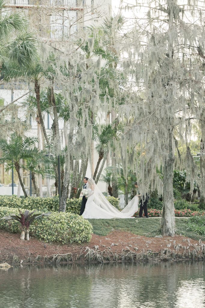 bride and her father walk into an outdoor wedding ceremony at Hyatt Regency Grand Cypress Resort in Orlando, Florida, captured by Jennifer Holly Photography