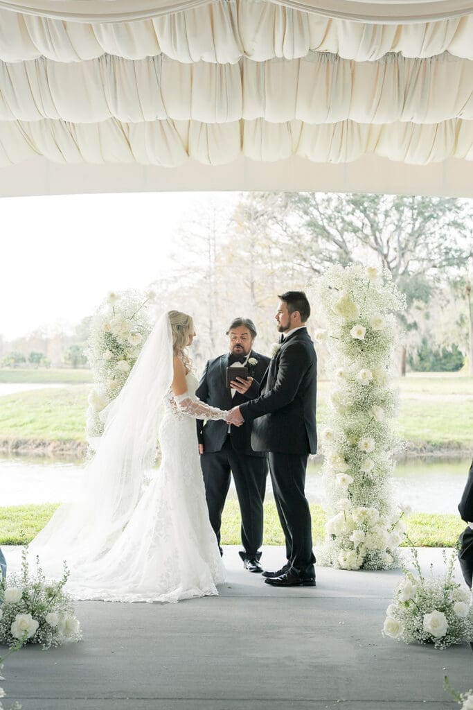bride and groom in an outdoor wedding ceremony at Hyatt Regency Grand Cypress Resort in Orlando, Florida, captured by Jennifer Holly Photography