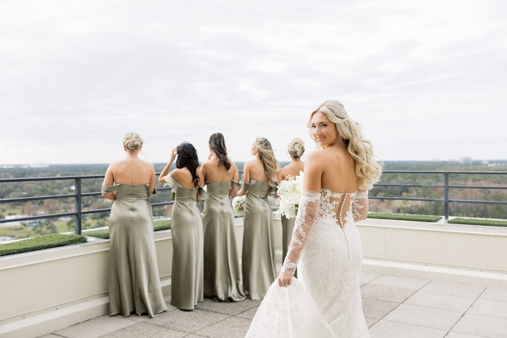 bride first look with bridesmaids before her wedding at Hyatt Regency Grand Cypress Resort in Orlando, Florida, captured by Jennifer Holly Photography