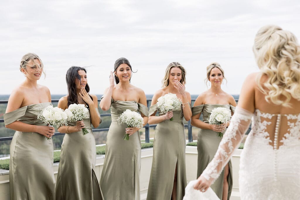 bride first look with bridesmaids before her wedding at Hyatt Regency Grand Cypress Resort in Orlando, Florida, captured by Jennifer Holly Photography