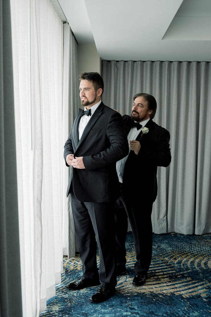 groom getting ready for his wedding at Hyatt Regency Grand Cypress Resort in Orlando, Florida, captured by Jennifer Holly Photography