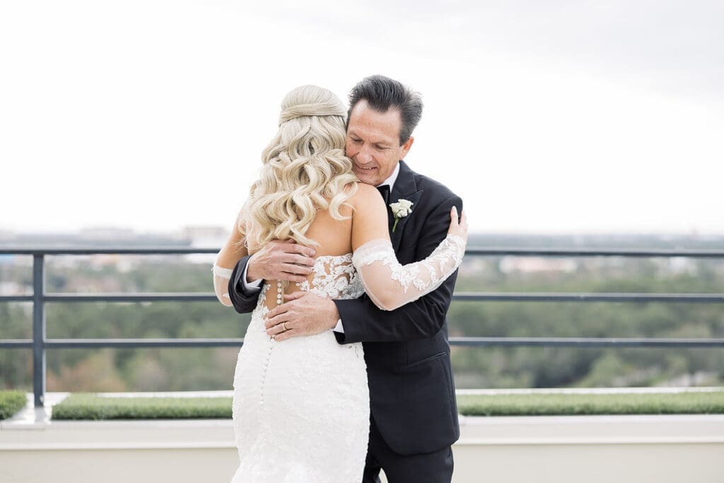 bride first look with her father before her wedding at Hyatt Regency Grand Cypress Resort in Orlando, Florida, captured by Jennifer Holly Photography