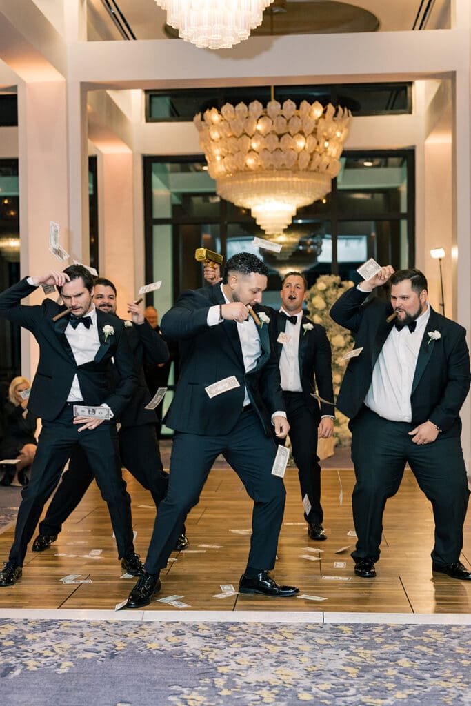 wedding reception groomsmen entrance at Hyatt Regency Grand Cypress Resort in Orlando, Florida, captured by Jennifer Holly Photography