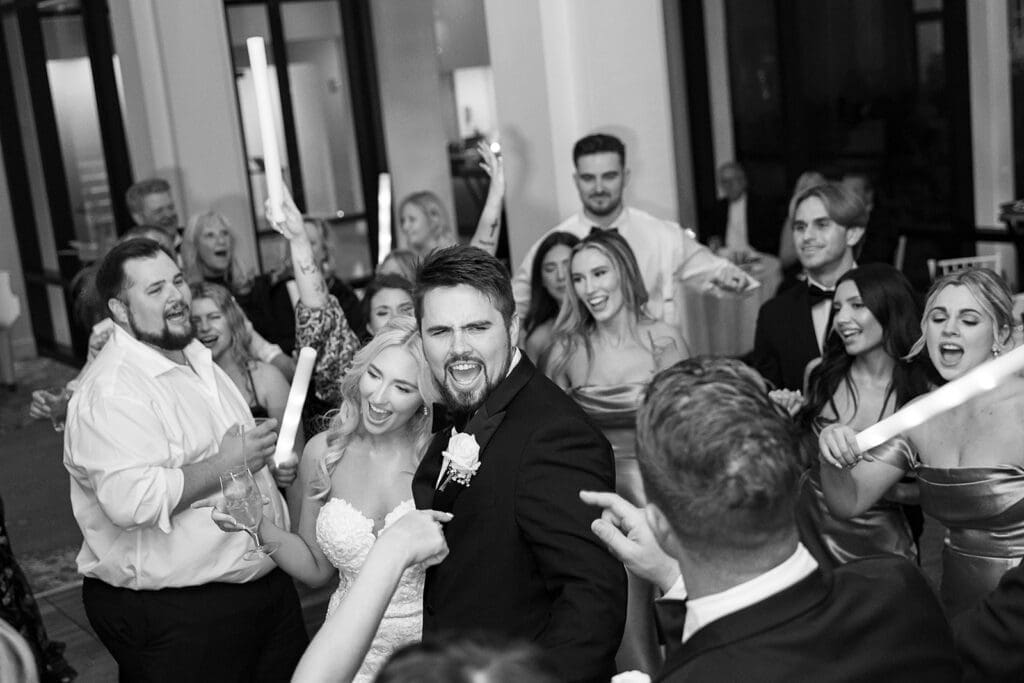 crowd on the dance floor at a wedding reception at Hyatt Regency Grand Cypress Resort in Orlando, Florida, captured by Jennifer Holly Photography