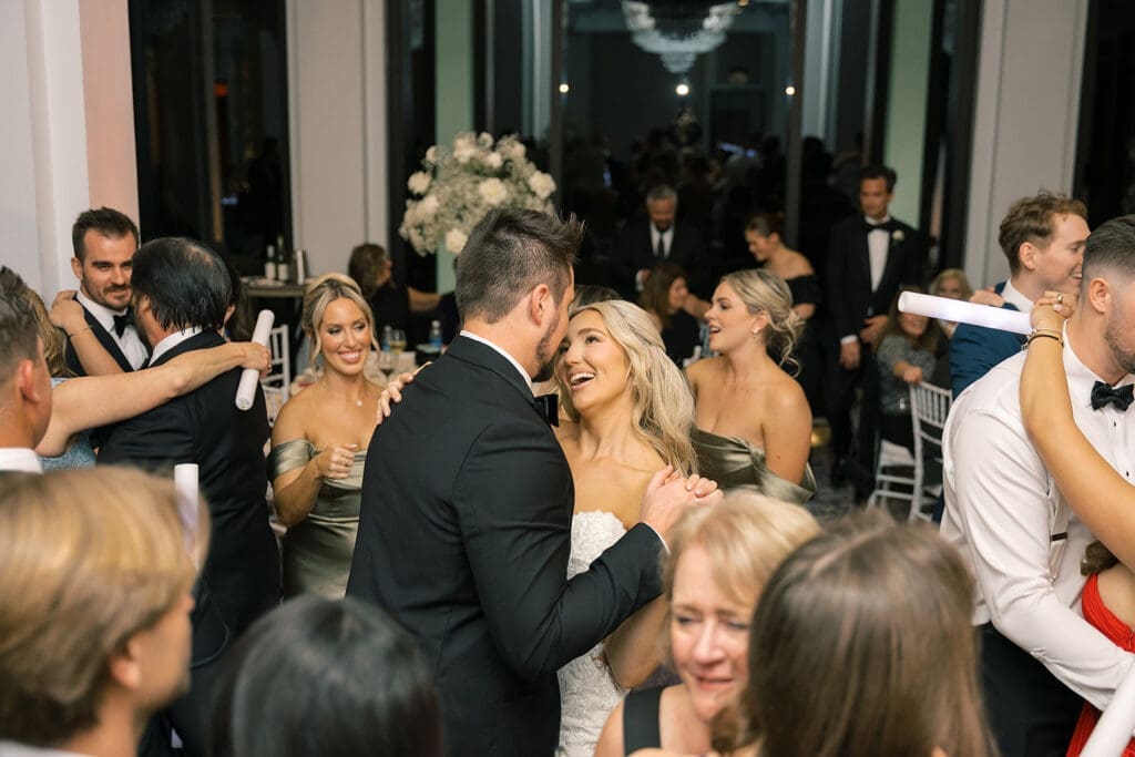 crowd on the dance floor at a wedding reception at Hyatt Regency Grand Cypress Resort in Orlando, Florida, captured by Jennifer Holly Photography