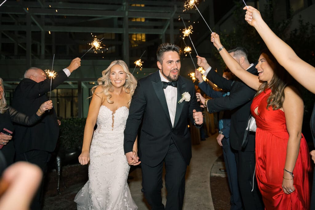 bride and groom sparkler exit from their wedding reception at Hyatt Regency Grand Cypress Resort in Orlando, Florida, captured by Jennifer Holly Photography