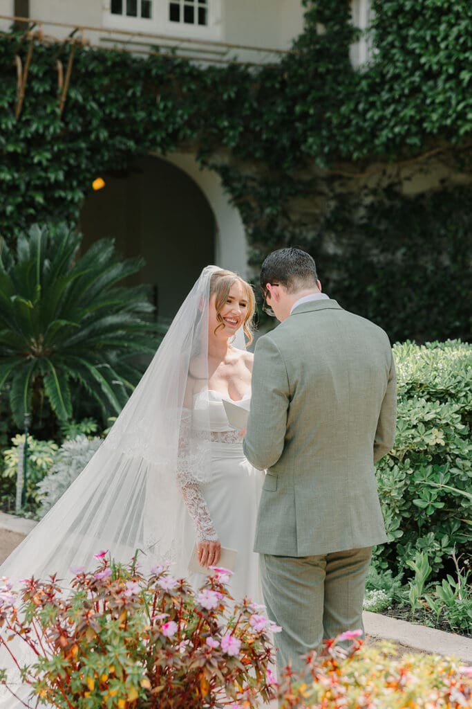 bride and groom stand share private vows in the garden at Sydonie Mansion in an elopement portrait captured by Jennifer Holly Photography, an Orlando elopement and wedding photographer