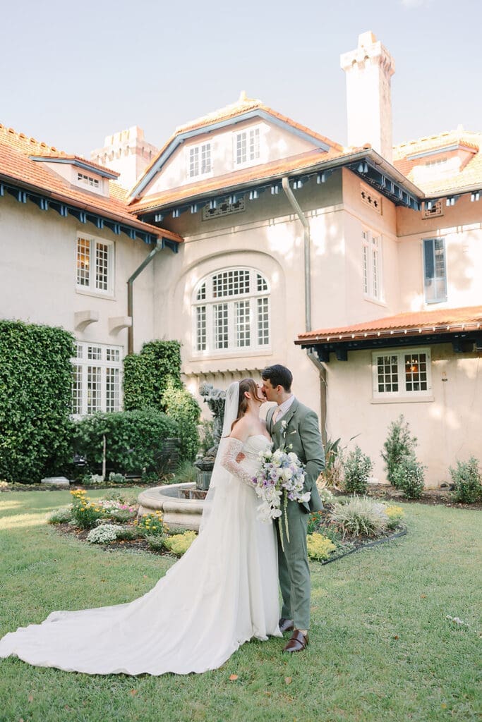 bride and groom stand share private vows in the garden at Sydonie Mansion in an elopement portrait captured by Jennifer Holly Photography, an Orlando elopement and wedding photographer