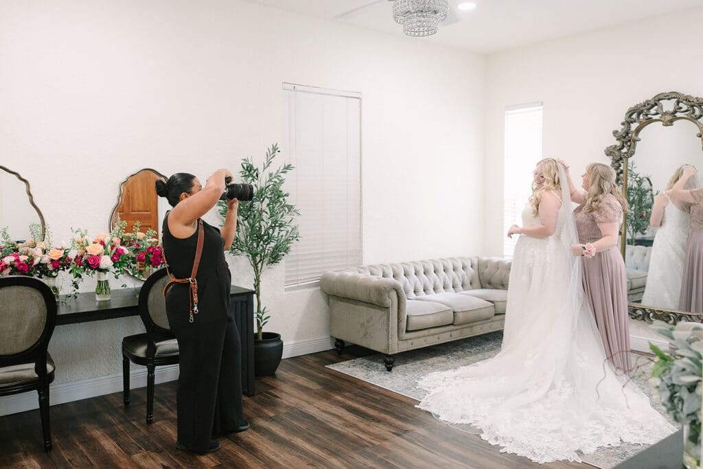 Jenn from Jennifer Holly Photography capturing a bridal portrait at Sterling Event Venue in Minneola FL