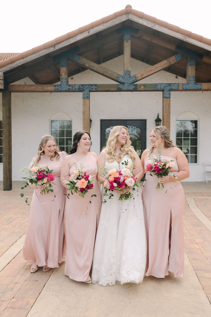 bride and bridesmaids wearing blush at a Sterling Event Venue wedding in Minneola FL captured by Jennifer Holly Photography