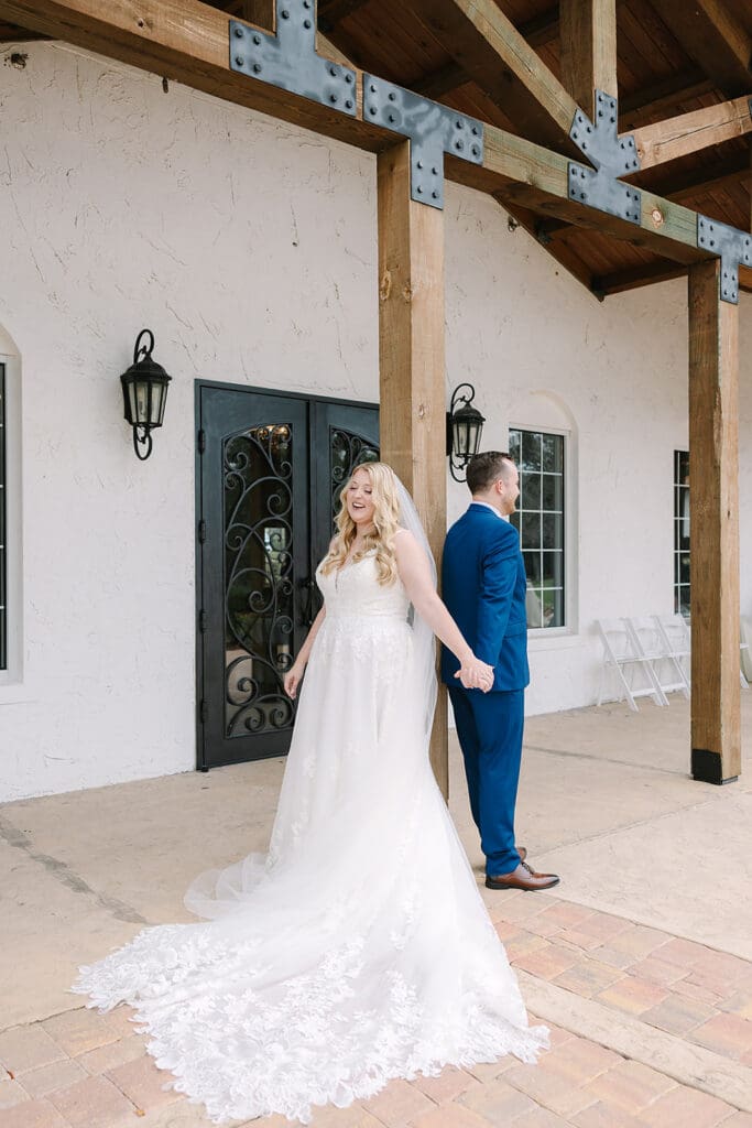 bride and groom first touch at a Sterling Event Venue wedding in Minneola FL captured by Jennifer Holly Photography