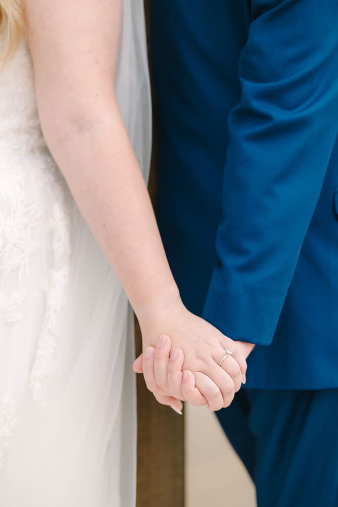 bride and groom first touch at a Sterling Event Venue wedding in Minneola FL captured by Jennifer Holly Photography