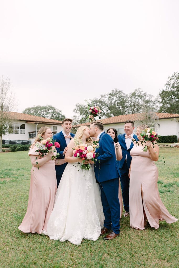 candid wedding party portrait on the lawn at Sterling Event Venue in Minneola FL captured by Jennifer Holly Photography