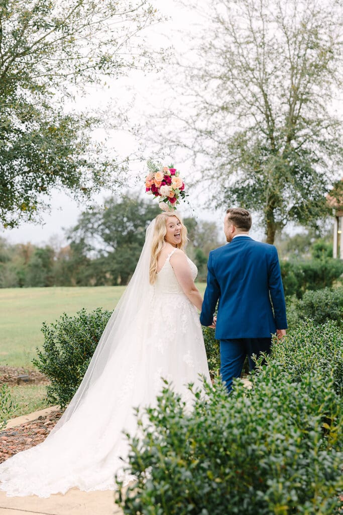 candid bride and groom portrait on the lawn at Sterling Event Venue in Minneola FL captured by Jennifer Holly Photography