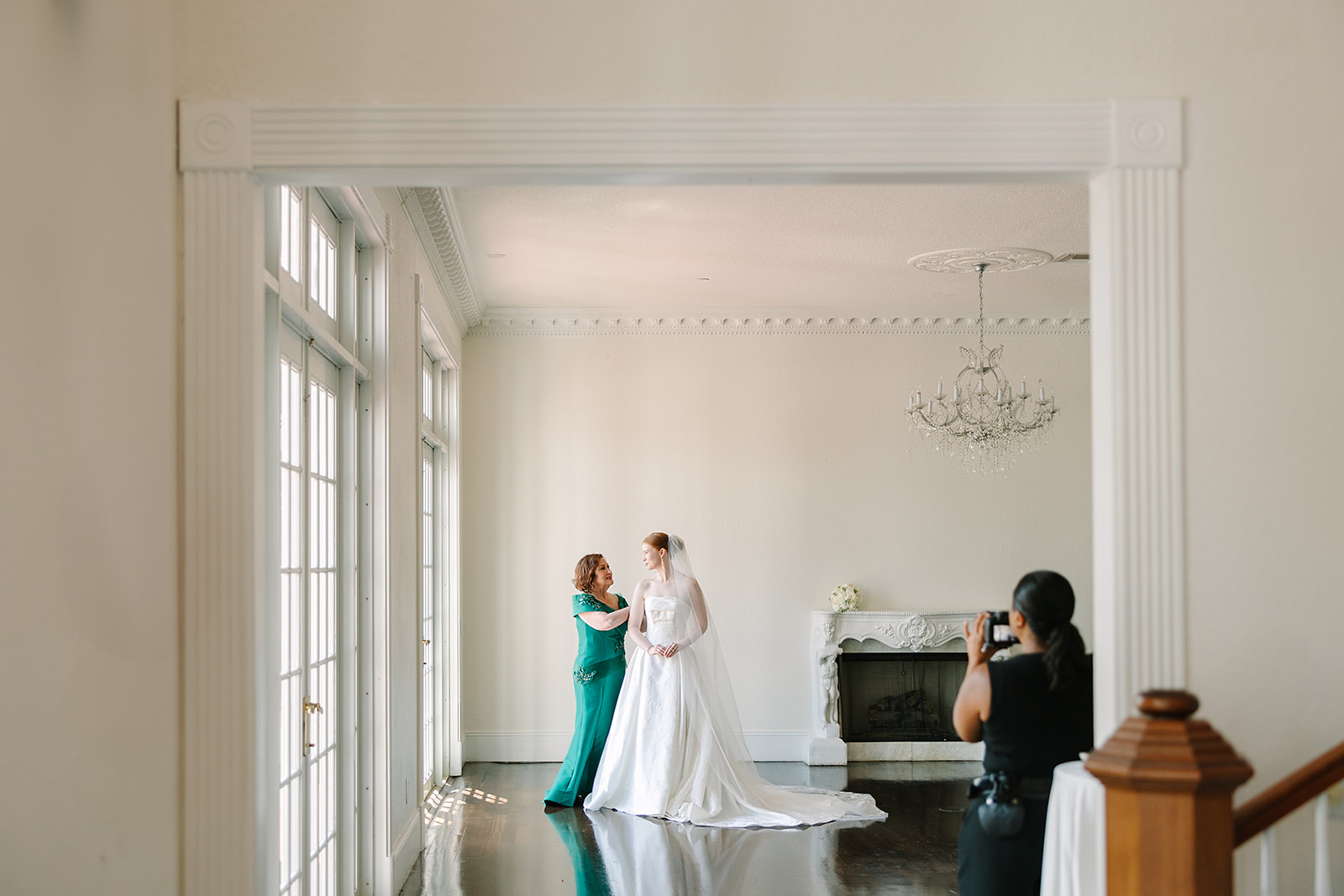 behind the scenes photo of Jennifer Holly Photography capturing a bride and her mother at Luxmore Grande Estate